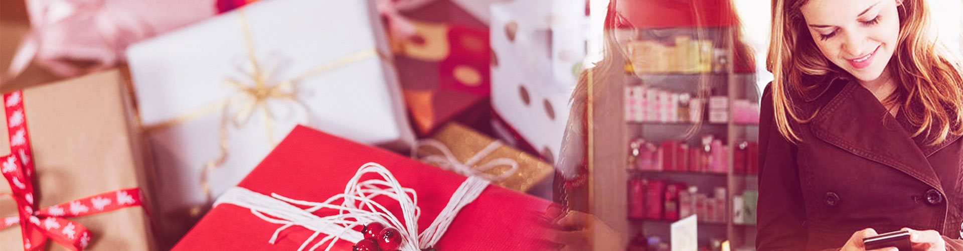 Blog banner featuring woman smiling at her phone in a store with image of gift boxes next to her