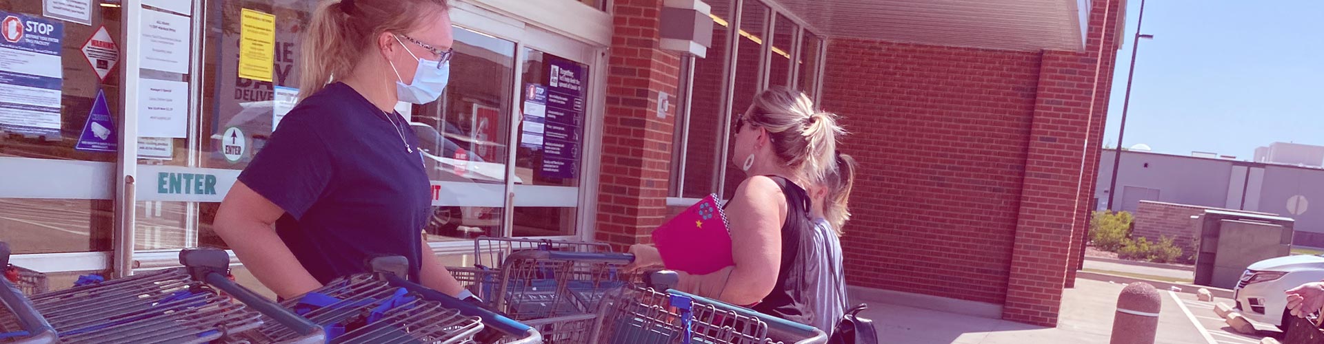Stores are Reopening | Lessons for Retailers blog banner featuring grocery store worker with mask and gloves putting carts away as customers walk into the store