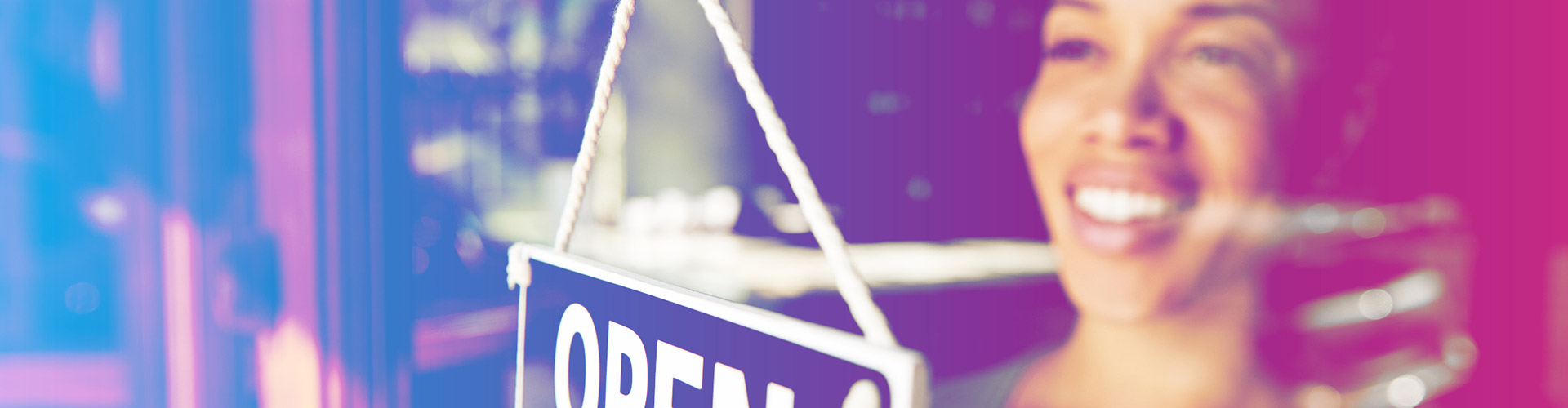 Supporting African American Entrepreneurship Blog banner featuring smiling young black woman flipping her store's open sign